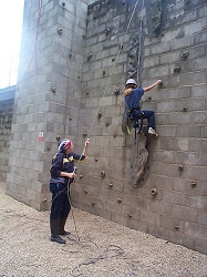 CLIMBING : a rangers encourages one of the Guides